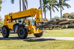 JCB 514-56 telescopic handler carrying a big rock. JCB 514-56 telescopic handler carrying a big rock.