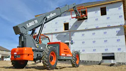 Skyjack’s TH series telehandler lifting pallets into a home. Skyjack’s TH series telehandler lifting pallets into a home.