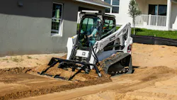 Bobcat T650 using a land plane to grade dirt near houses. Bobcat T650 using a land plane to grade dirt near houses.
