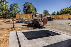 Bobcat T86 compact track loaders carrying a pallet of materials. Bobcat T86 compact track loaders carrying a pallet of materials.