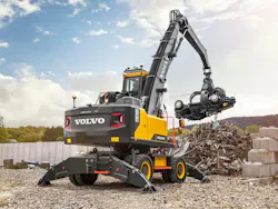Volvo EW240 Material Handler picking up some scrap Volvo EW240 Material Handler picking up some scrap