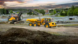 Volvo Construction Equipment excavator dumping into an ADT. Volvo Construction Equipment excavator dumping into an ADT.