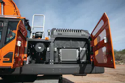 Develon excavator maintenance, radiator door swung open. Develon excavator maintenance, radiator door swung open.