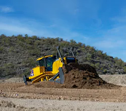 Komatsu D175AX-10 dozer pushing dirt in the desert. Komatsu D175AX-10 dozer pushing dirt in the desert.