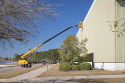 JCB boom lift reaching to the top of its company headquarters JCB boom lift reaching to the top of its company headquarters