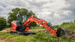Kubota KX040-5 compact excavator reaching to full extension. Kubota KX040-5 compact excavator reaching to full extension.