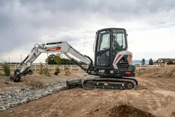 Bobcat E35 compact excavator digging gravel. Bobcat E35 compact excavator digging gravel.