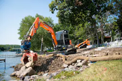Develon DX62R-7 mini excavator grappling big rocks. Develon DX62R-7 mini excavator grappling big rocks.