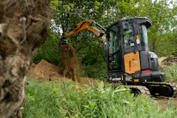 Case Construction Equipment CX38D mini excavator dumping dirt from a bucket. Case Construction Equipment CX38D mini excavator dumping dirt from a bucket.