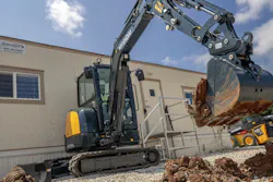 Hyundai HX35AZ compact excavator digging dirt. Hyundai HX35AZ compact excavator digging dirt.