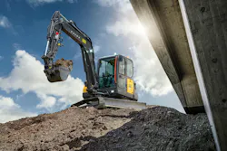 Volvo Construction Equipment EC65 compact excavators sitting in the sun. Volvo Construction Equipment EC65 compact excavators sitting in the sun.