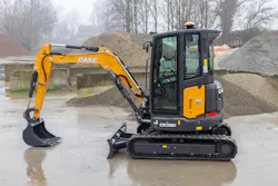 Case CW38d mini excavator sitting in a landscaping yard. Case CW38d mini excavator sitting in a landscaping yard.