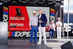 U.S Navy Veteran Keelan Brown with Kubota Tractor Corporation President Alex Woods.
