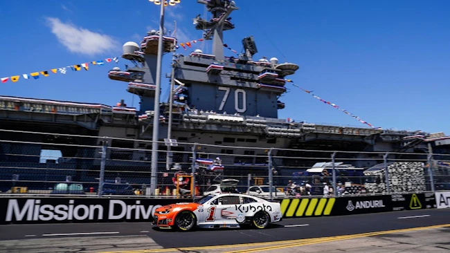 Trackhouse Racing's Ross Chastain drives the #1 Kubota Chevrolet in front of the USS Carl Vinson during the Anduril 250 at Naval Base Coronado on Sunday.