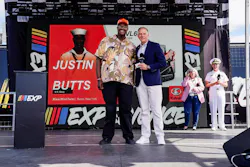 U.S Navy Veteran Justin Butts with Kubota Tractor Corporation President Alex Woods.
