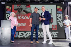 U.S Marine Corps Veteran Hudson Grigg with Kubota Tractor Corporation President Alex Woods.