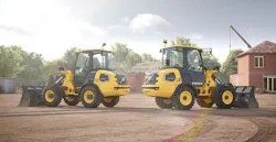 Volvo electric compact wheel loaders sitting back to back.