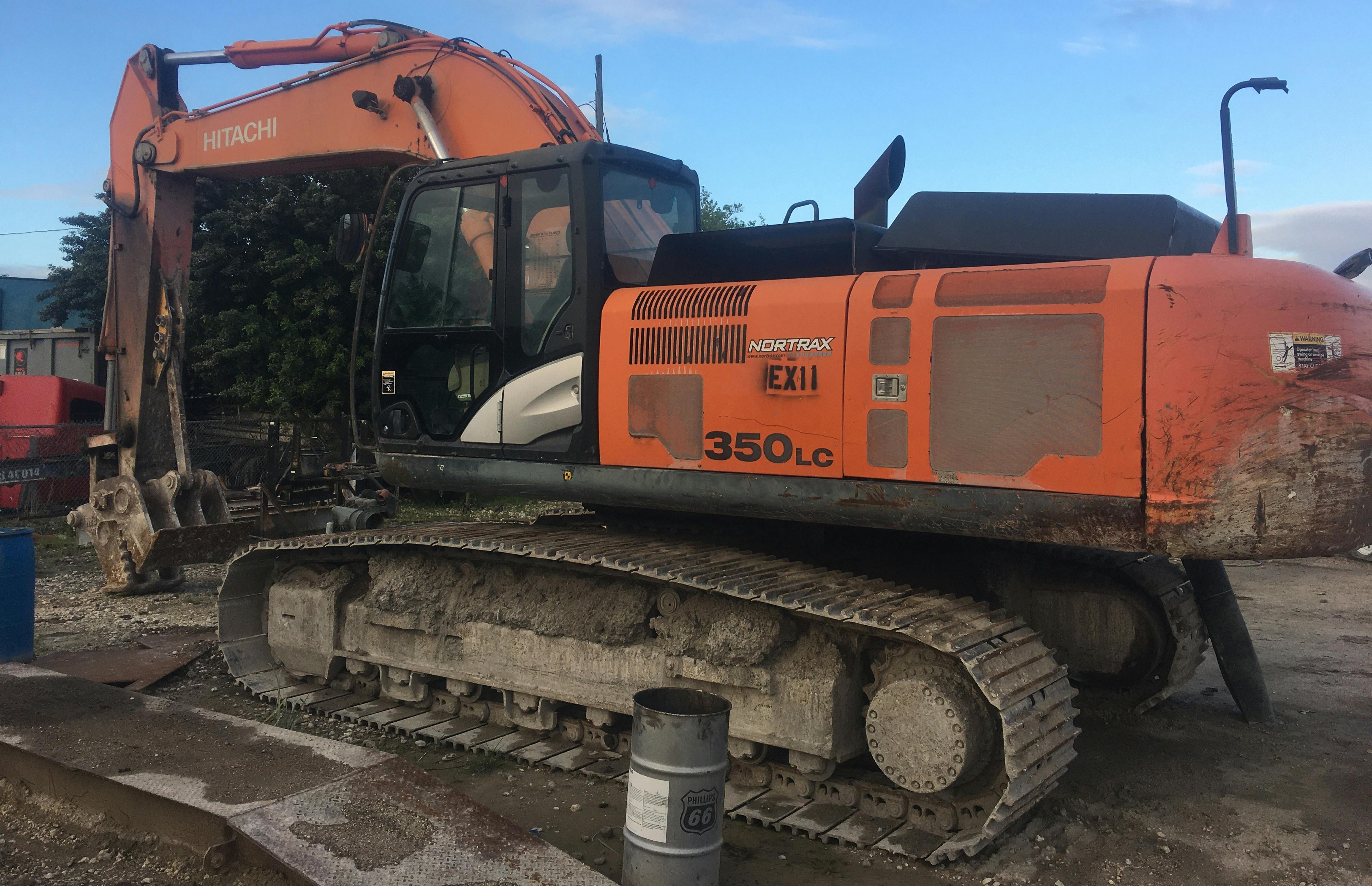 Excavator with oil can