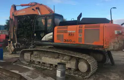 Excavator with oil can