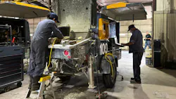 Techs perform service in a shop