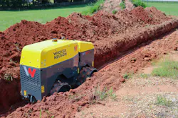 Wacker Neuson's RTD-SC4 trench roller, rolling through a trench.
