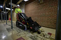 Toro TX750 using a floor scraper attachment indoors.