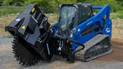 Blue Diamond road saw attachment on a blue compact track loader.