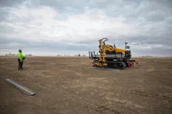 Vermeer MT500 Material Transporter picking up solar beams for install.