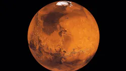 Mars, bright orange, floating through space.