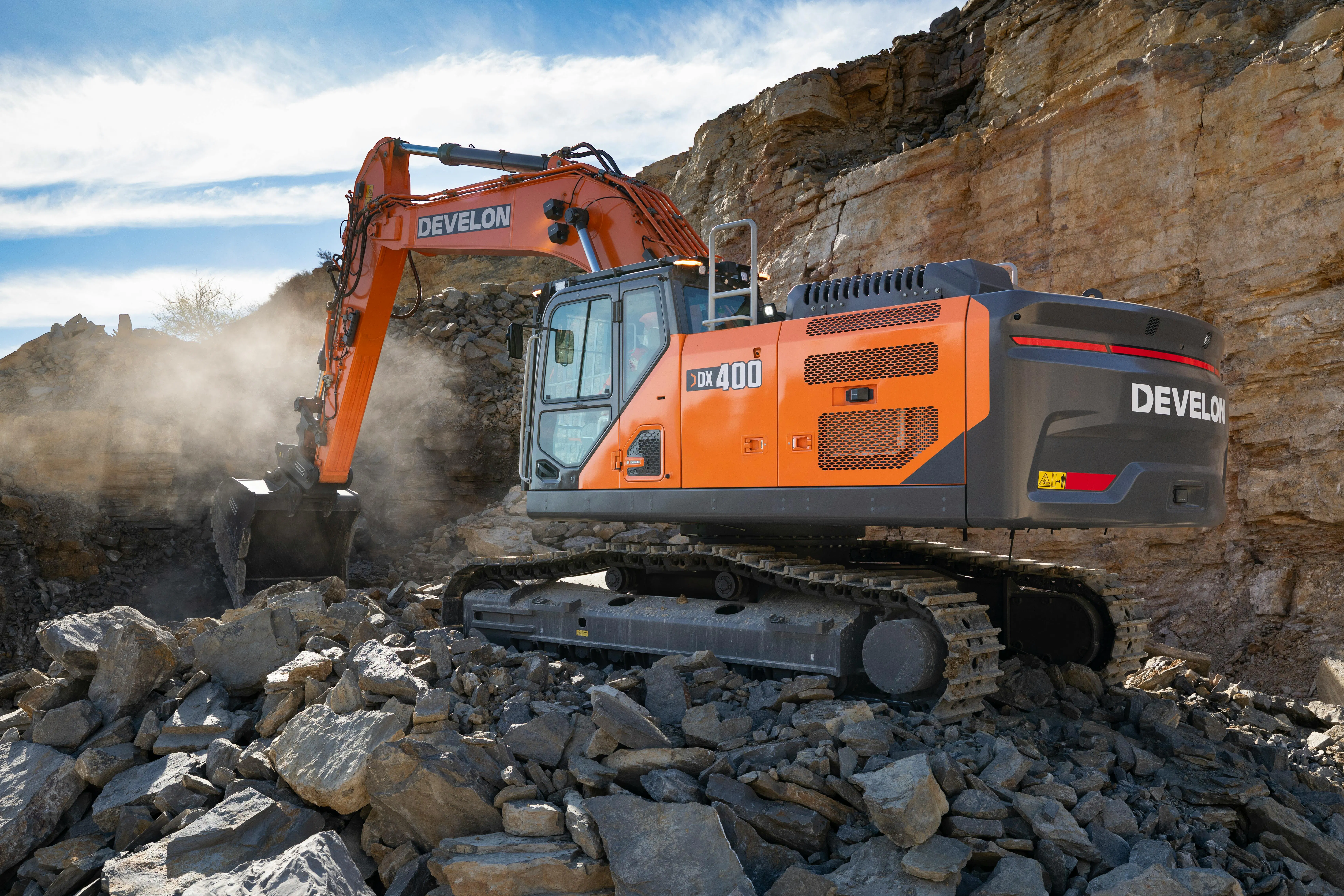 Develon -9 Series excavator working on rocks.