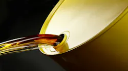 Fuel coming out a yellow barrel.