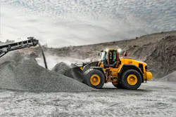 Volvo Construction Equipment L260 wheel loader moving piles of gravel.