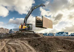 Volvo ECR255 Crawler Excavator holding up a trench box.