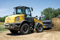 New Holland Construction W80 compact equipment wheel loader working.