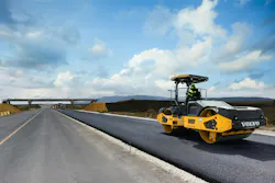 Volvo Construction Equipment DD128C tandem asphalt roller compacting highway asphalt.