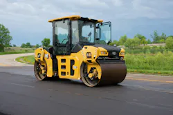 Cat CB10 tandem vibratory roller working a on road project.
