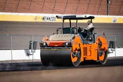 Hamm HD+ 120i VIO-2 HF tandem roller paving a track.