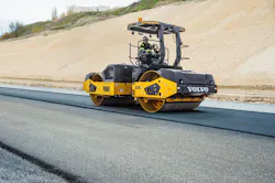 Volvo Construction Equipment DD128C tandem asphalt roller, working a road.