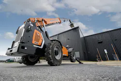 Skytrak 12054 telehandler lifting a pallet, shot down low.