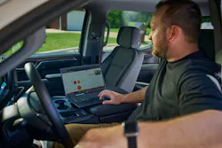 Ditch Witch Orange Intel telematics on a laptop in a truck.