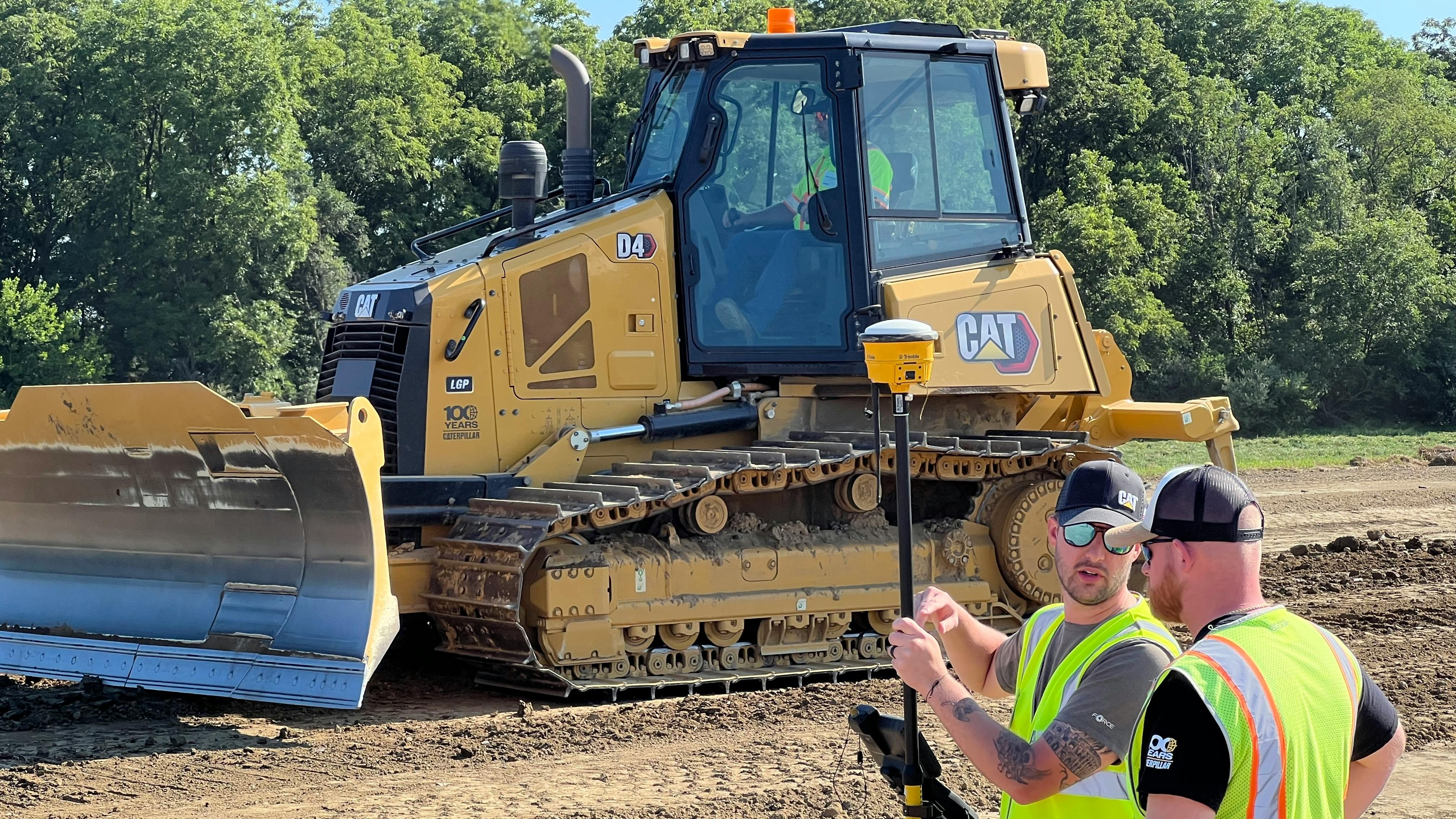 Cat dozer, survey crew