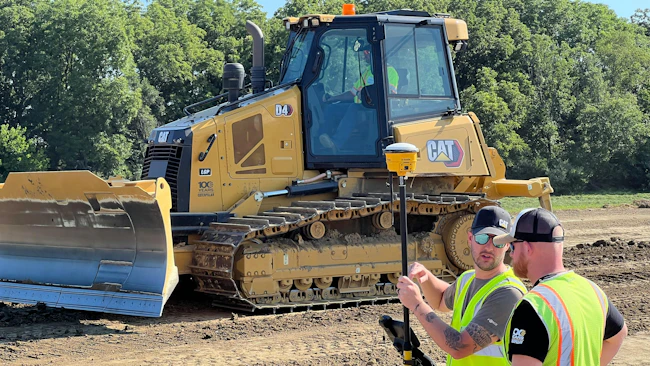Cat dozer, survey crew