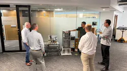 People looking at equipment