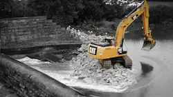 Excavator near dam