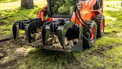 Ignite Attachment bucket grapple holding logs. and rocks.