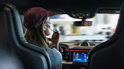 Woman demonstrating distracted driving