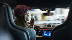 Woman demonstrating distracted driving