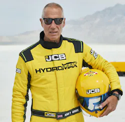 Andy Green with JCB yellow Hydromax outfit fit for land speed record.