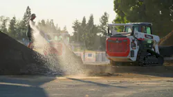 Bobcat compact track loaders construction dirt tracks in the sun.