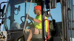 Bobcat wheel loader operator, hat flipped back. Respect.